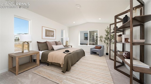 bedroom with light carpet and lofted ceiling