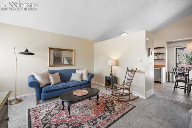 living room with a textured ceiling, dark carpet, and lofted ceiling