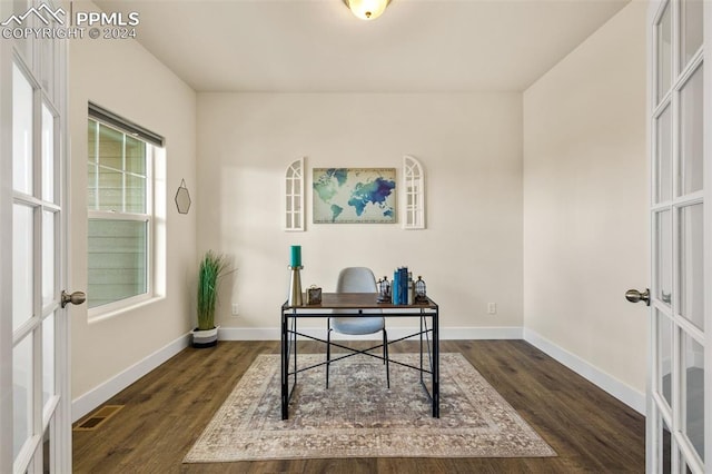 office area with dark wood-type flooring, plenty of natural light, and french doors