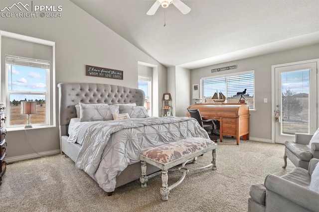 bedroom featuring ceiling fan, vaulted ceiling, carpet floors, and multiple windows