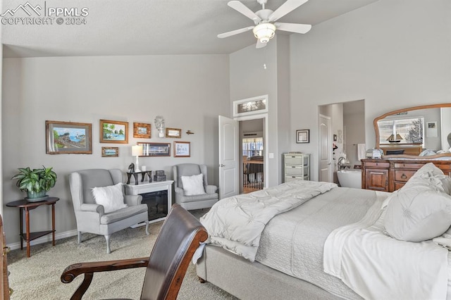 bedroom featuring ceiling fan and high vaulted ceiling