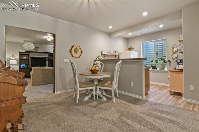 dining space with light carpet