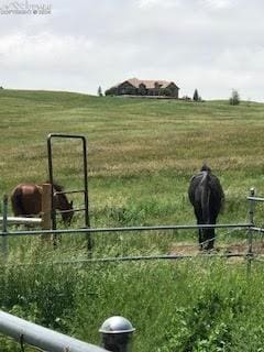 exterior space with a rural view