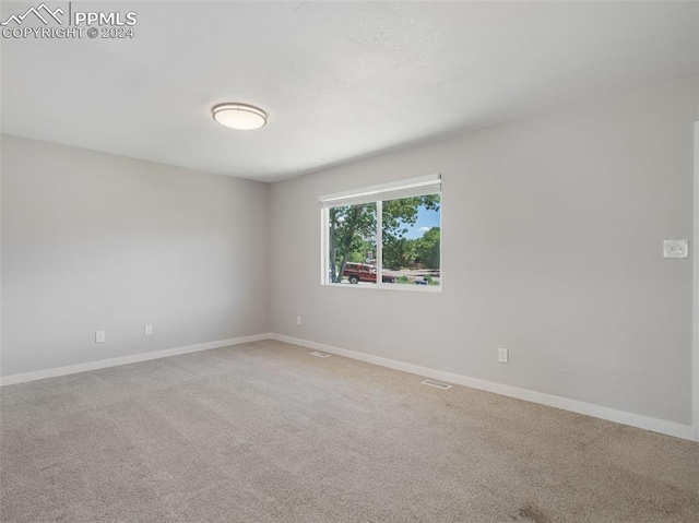 view of carpeted spare room