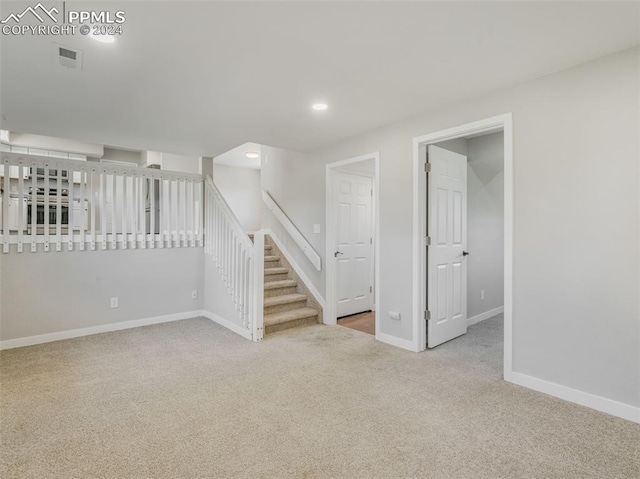 unfurnished living room featuring carpet floors