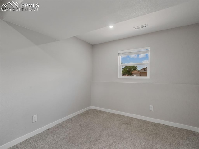 spare room with carpet floors