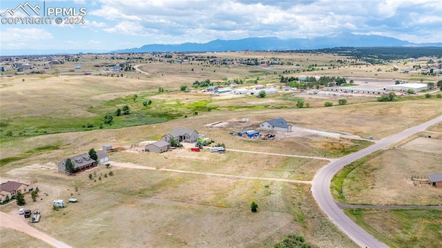 aerial view featuring a mountain view and a rural view