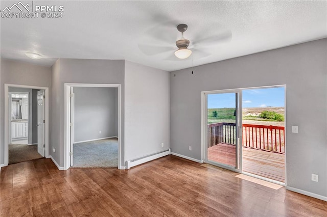 unfurnished room with baseboard heating, ceiling fan, and hardwood / wood-style floors