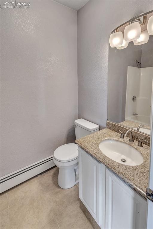 full bathroom with  shower combination, vanity, toilet, and a baseboard heating unit