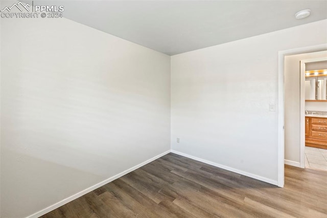 unfurnished room featuring wood-type flooring