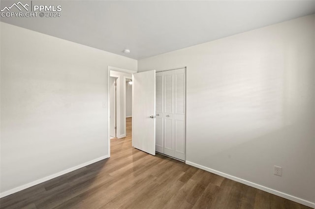 unfurnished bedroom featuring hardwood / wood-style floors