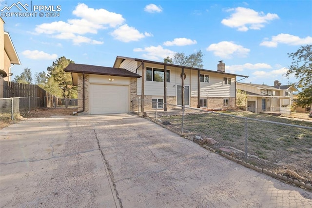 raised ranch featuring a garage