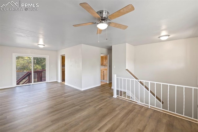 unfurnished room with hardwood / wood-style floors and ceiling fan