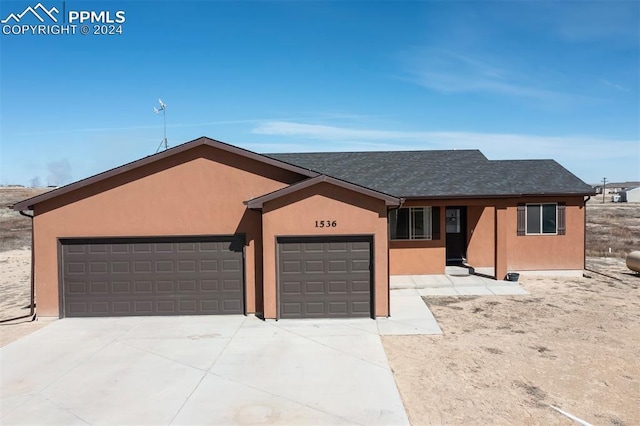 single story home with a garage