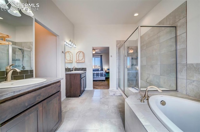 bathroom with vanity, separate shower and tub, and ceiling fan