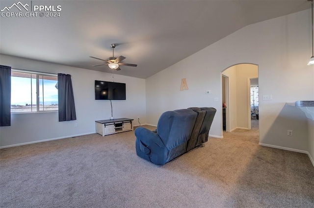 living room with carpet flooring, ceiling fan, and vaulted ceiling