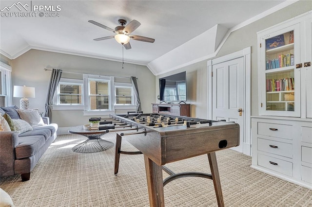 recreation room featuring ceiling fan, crown molding, and vaulted ceiling