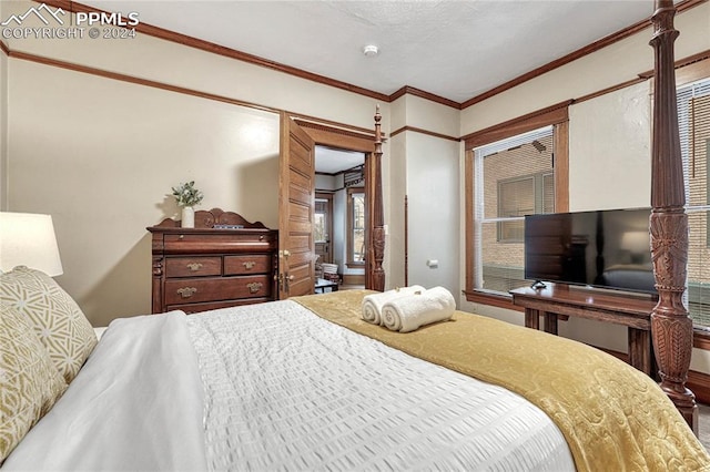 bedroom with crown molding