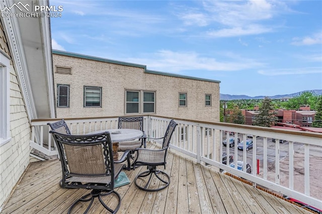 wooden terrace featuring a mountain view