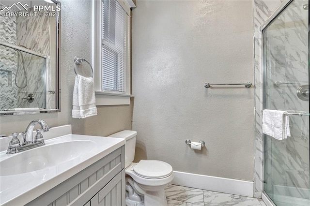 bathroom with toilet, an enclosed shower, and vanity