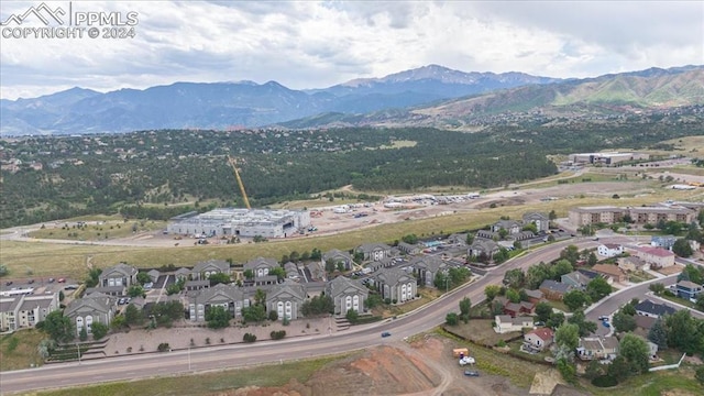 birds eye view of property with a mountain view