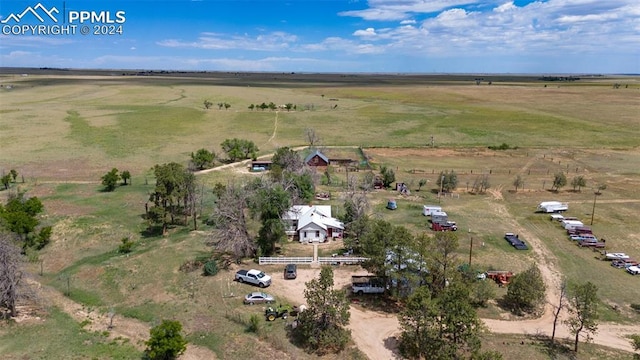 birds eye view of property with a rural view