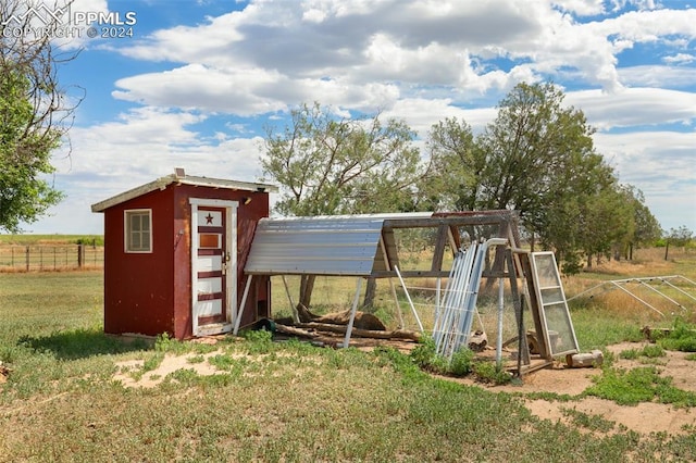 exterior space with a lawn and a rural view