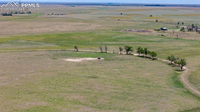 birds eye view of property featuring a rural view