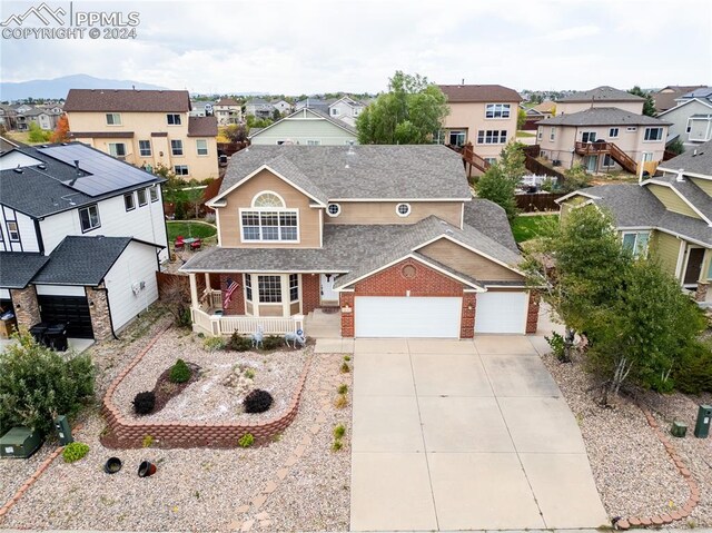 view of front of property featuring a porch and a garage