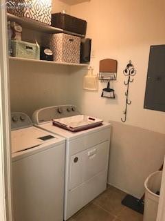 laundry area with tile flooring and washing machine and clothes dryer