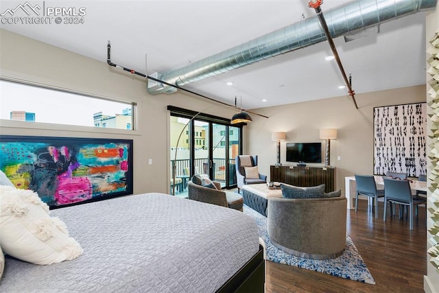 bedroom featuring dark hardwood / wood-style floors and multiple windows