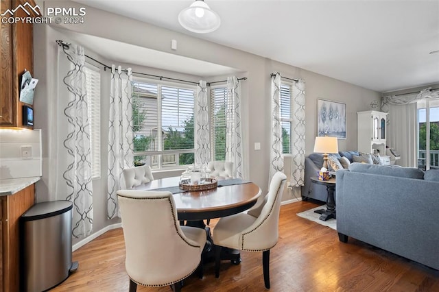 dining area featuring hardwood / wood-style flooring