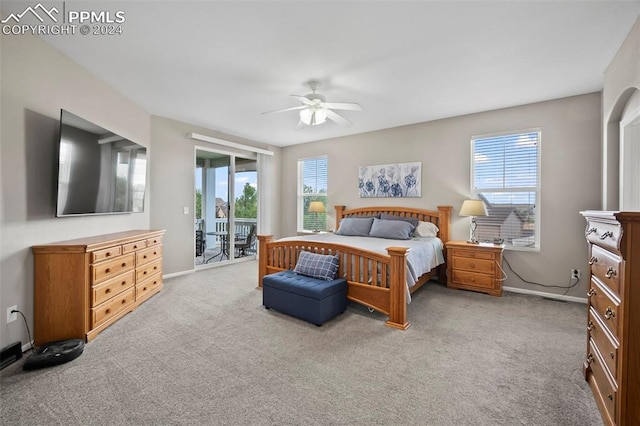 bedroom featuring light carpet, multiple windows, ceiling fan, and access to outside