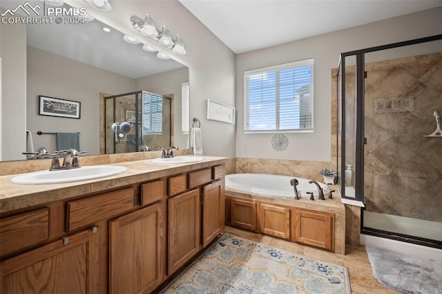 bathroom featuring tile patterned flooring, vanity, and independent shower and bath