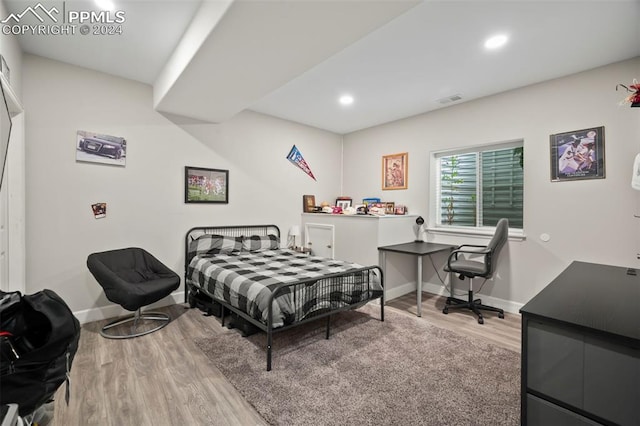 bedroom featuring light wood-type flooring