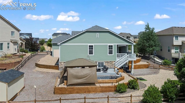 rear view of property featuring a patio