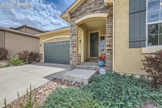 doorway to property featuring a garage