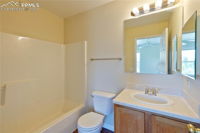 full bathroom featuring bathing tub / shower combination, ceiling fan, vanity, and toilet