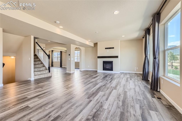 unfurnished living room featuring light wood-type flooring