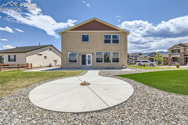 back of house featuring a yard