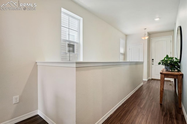 corridor with dark hardwood / wood-style floors