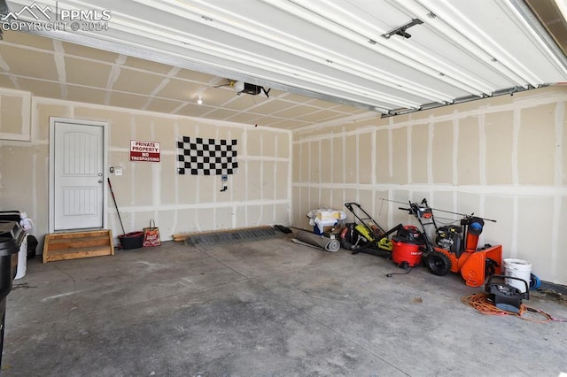 garage featuring a garage door opener