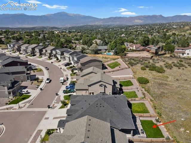 birds eye view of property with a mountain view