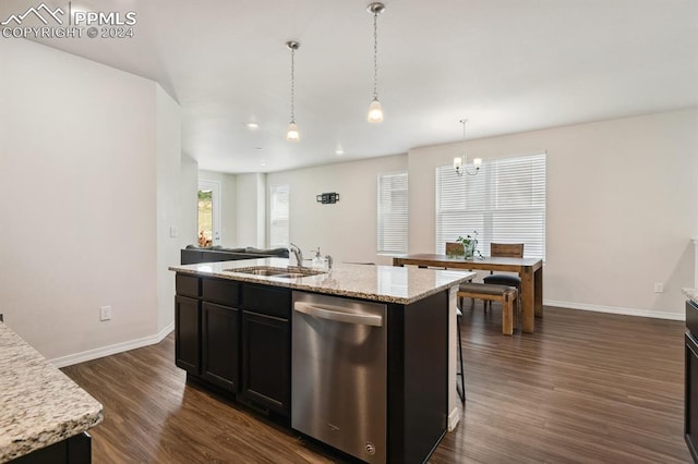 kitchen featuring dishwasher, a center island with sink, sink, light stone countertops, and dark hardwood / wood-style flooring