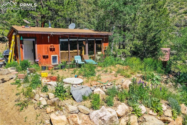 exterior space featuring a sunroom