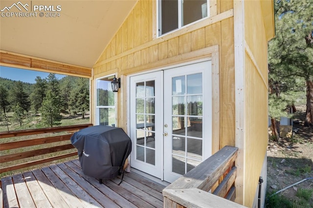 deck with french doors and a grill