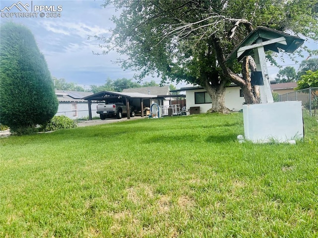 view of yard with a carport