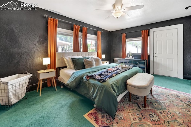 carpeted bedroom with ceiling fan