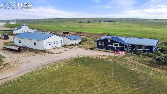 birds eye view of property featuring a rural view