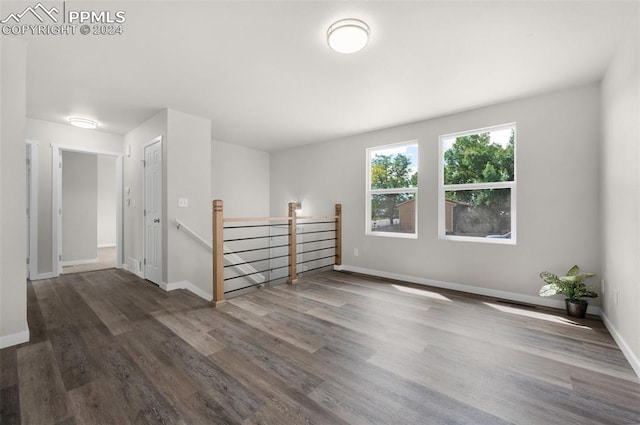 spare room featuring dark hardwood / wood-style floors